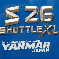 Надписью "SHUTTLE XL" отмечаются трактора, которые оснащаются реверсом и синхронизированной МКПП.
